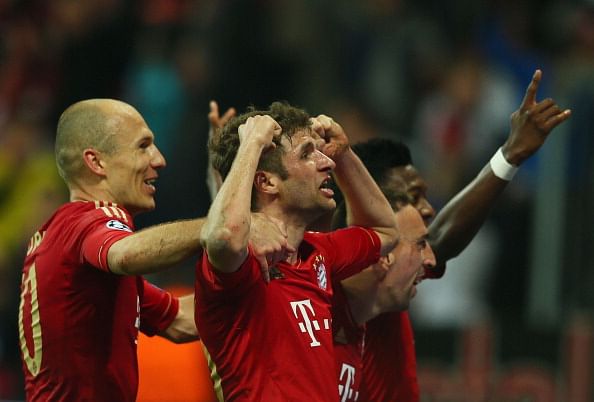 Thomas Mueller of Bayern Muenchen celebrates scoring the fourth goal with Arjen Robben (L) during the UEFA Champions League Semi Final First Leg match between FC Bayern Muenchen and Barcelona at Allianz Arena on April 23, 2013 in Munich, Germany. (Photo by Alex Grimm/Bongarts/Getty Images)